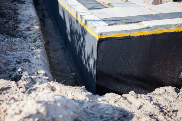Professional Emergency Waterproofing technician working in Honeoye Falls, NY